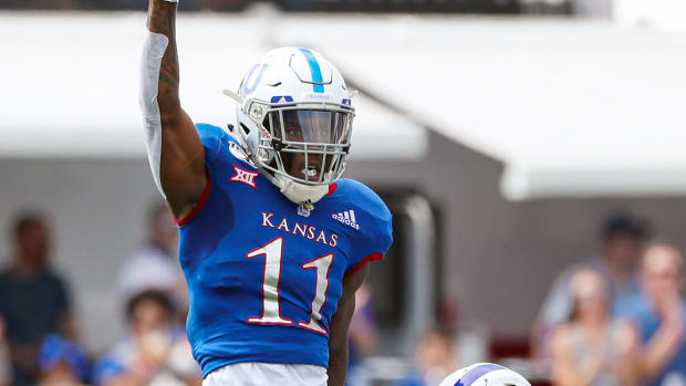 Aug 31, 2019; Lawrence, KS, USA; Kansas Jayhawks safety Mike Lee (11) celebrates after tackling Indiana State Sycamores wide receiver Dakota Caton (83) during the first half at David Booth Kansas Memorial Stadium. Mandatory Credit: Jay Biggerstaff-USA TODAY Sports